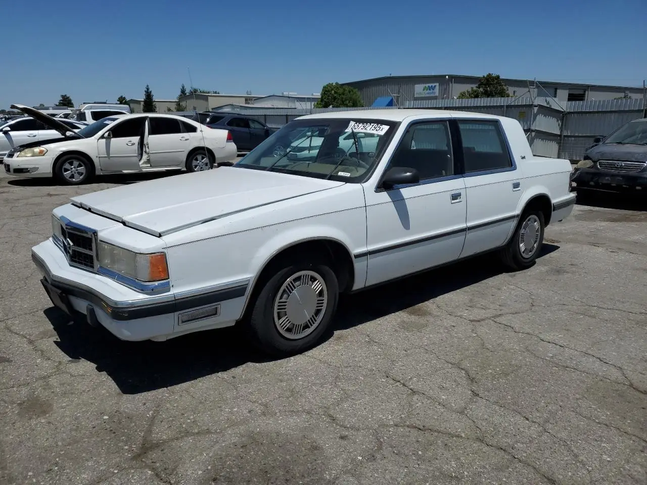 DODGE DYNASTY 1989. Lot# 65792195. VIN 1B3BC463XKD594439. Photo 1