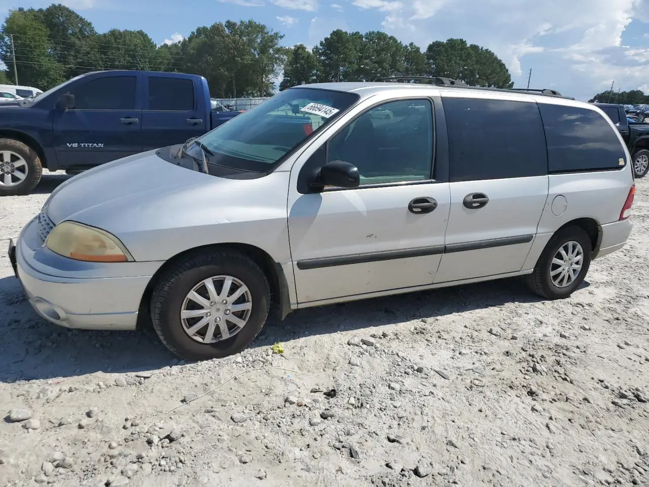 FORD WINDSTAR 2003. Lot# 66694145. VIN 2FMZA51403BA77386. Photo 1