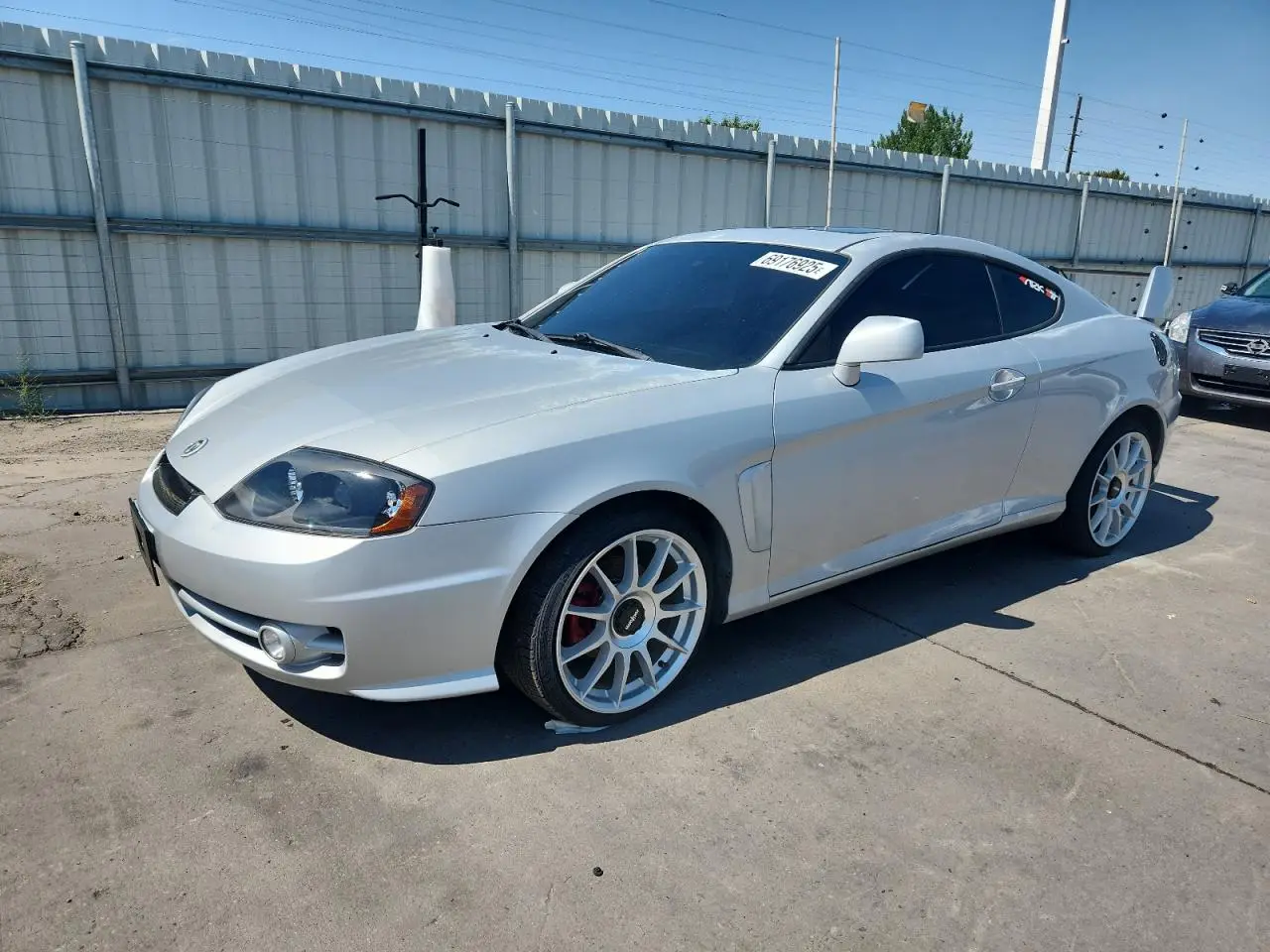HYUNDAI TIBURON 2004. Lot# 69176925. VIN KMHHN65F24U111292. Photo 1
