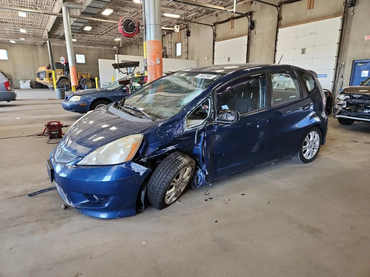 HONDA FIT 2010. Lot# 70322965. VIN JHMGE8H44AC018764. Photo 1
